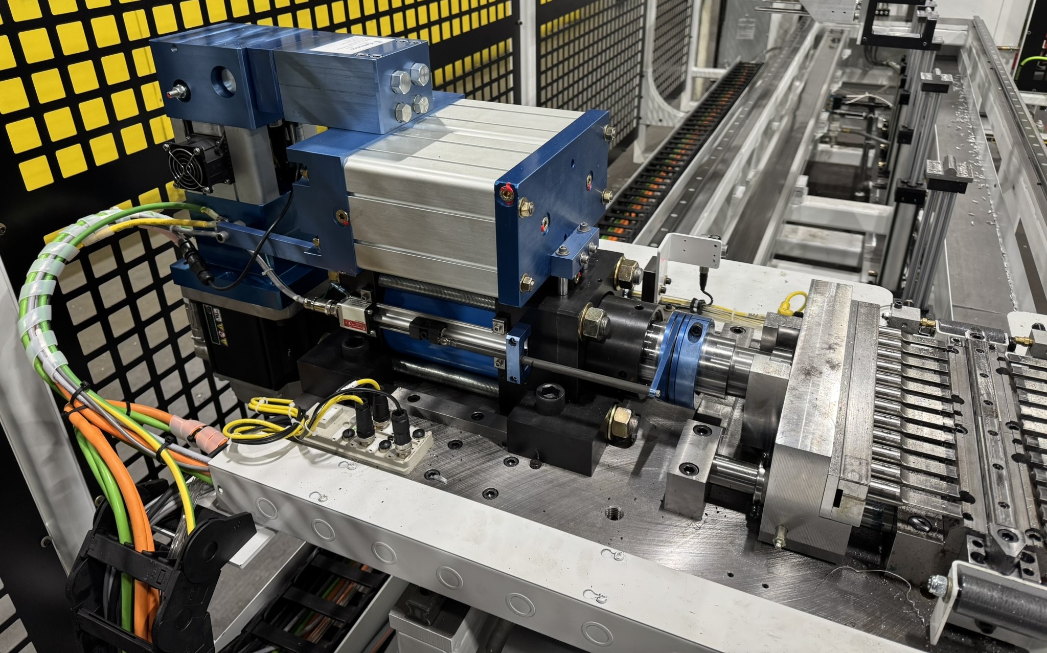 SYNCHRONIZED HYBRID ACTUATORS IMPROVE CONTROL AND EFFICIENCY IN ALUMINUM PUNCH PRESS